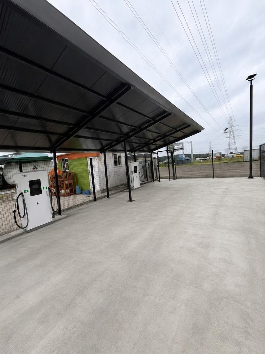 Blue Point EV charging canopy with DC fast chargers and supporting power infrastructure