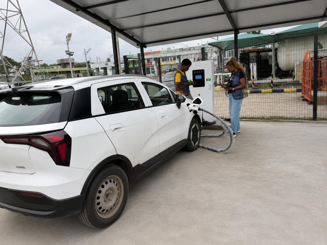 Blue Point staff charging a white electric SUV at the NNPC retail station forecourt in Ikota, Lagos